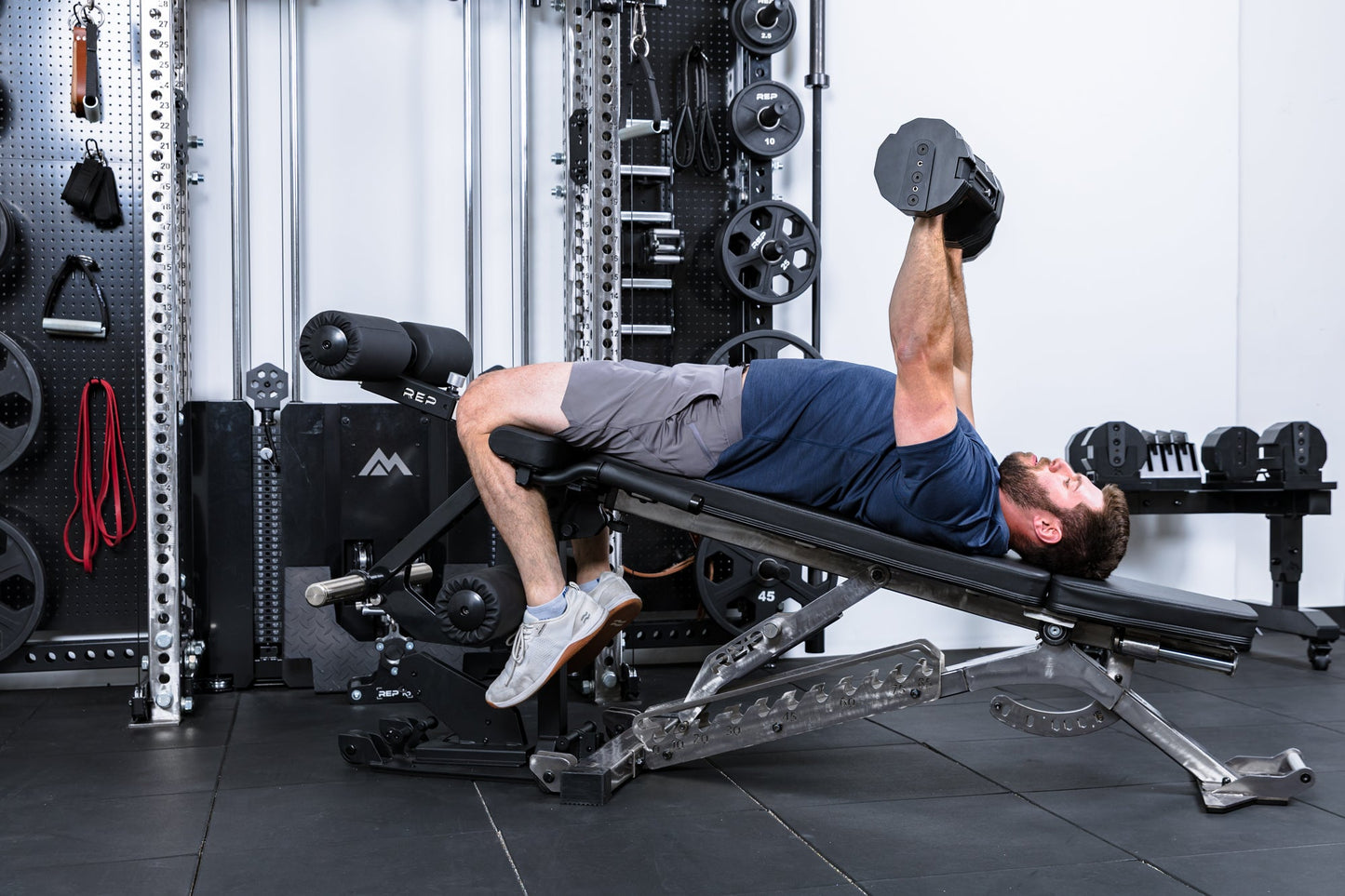 Athlete doing decline bench on the Leg Extension & Leg Curl Bench Attachment on a BlackWing